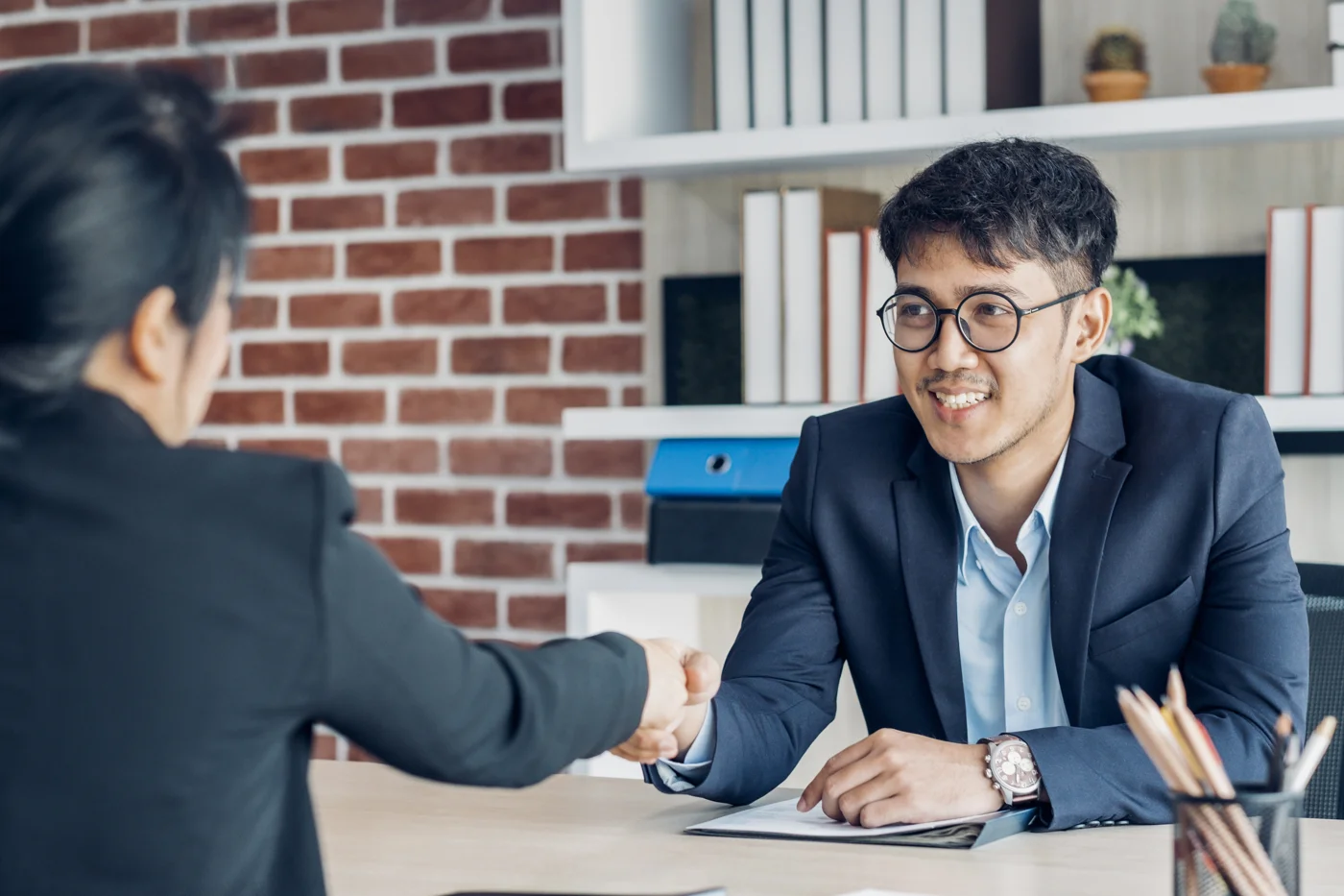A business owner discussing financial records with an adviser